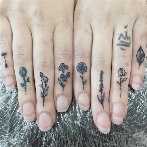 Flower On Finger Tattoo